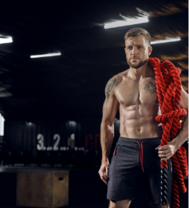 young-healthy-man-athlete-posing-confident-with-ropes-gym